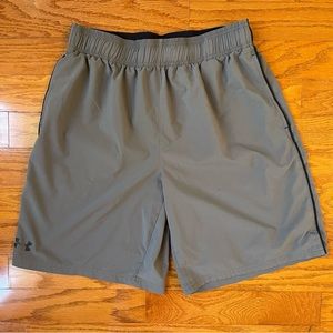 Under Armour Mens size Large  gray athletic shirts with black logo on back.